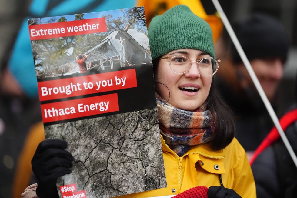 \u200bClimate activists from Greenpeace and Uplift during a demonstration outside the Scottish Court of Session, Edinburgh