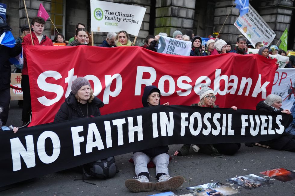 \u200bClimate activists from Greenpeace and Uplift during a demonstration