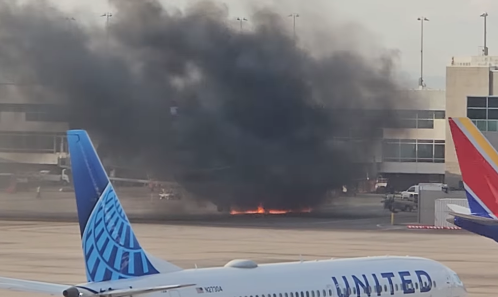 \u200bClouds of smoke engulfed the passengers, as they make their way away from the aircraft