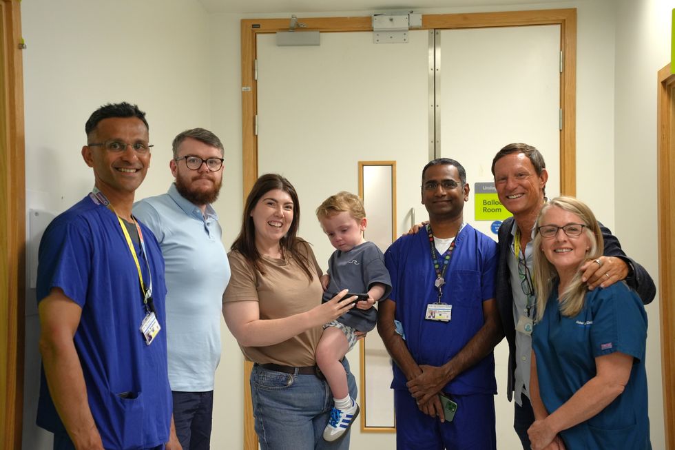 \u200bConor and his family pictured with nurses and doctors