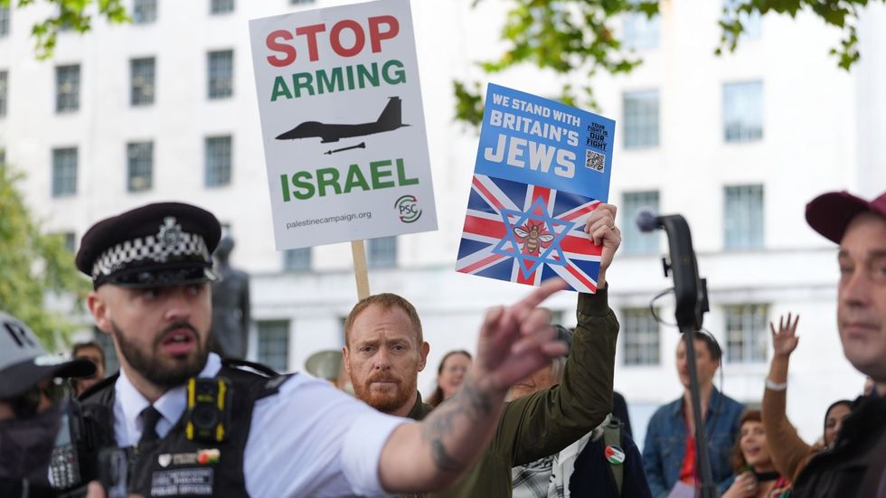 \u200bCounter-protesters held up placards reading 'we stand with Britain's Jews'
