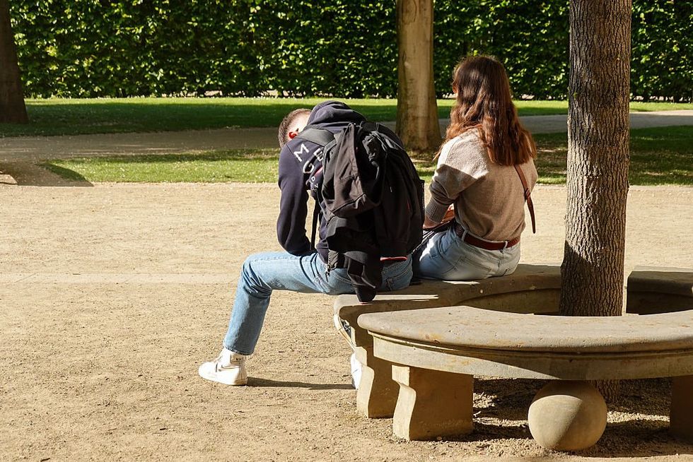 \u200bCouple in tense moment on park bench