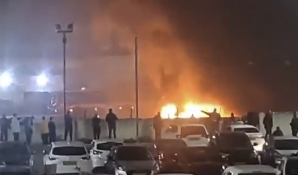 \u200bCrowds of residents assembling as flames and smoke poured out into the sky