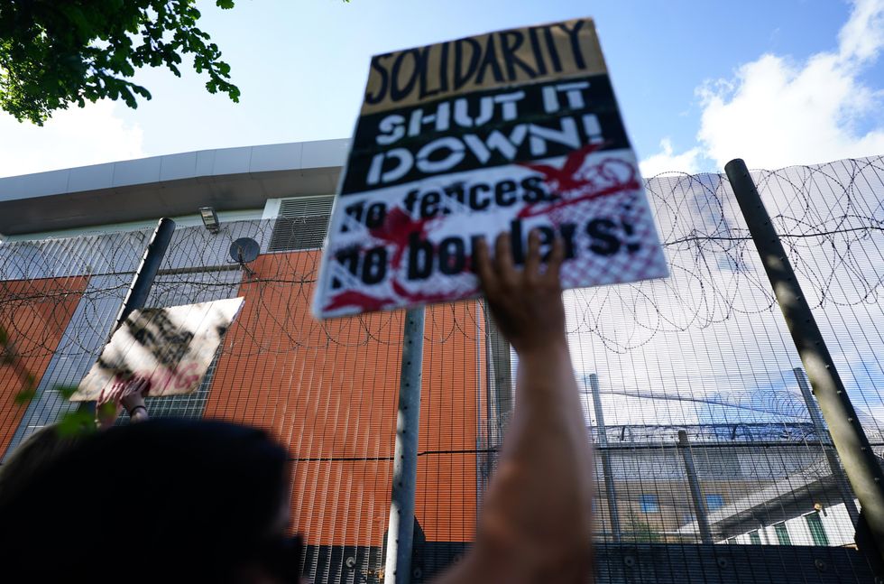 \u200bDemonstrators at a removal centre at Gatwick protest against plans to send migrants to Rwanda