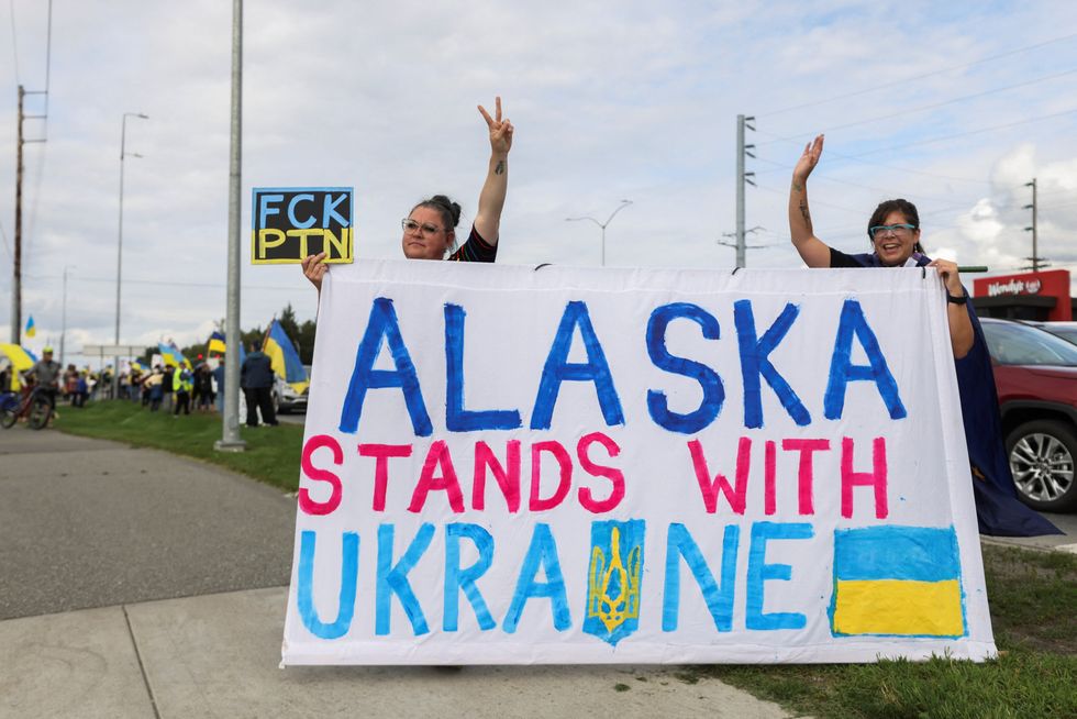 \u200bDemonstrators hold a banner during a protest in solidarity with Ukraine in Anchorage, Alaska