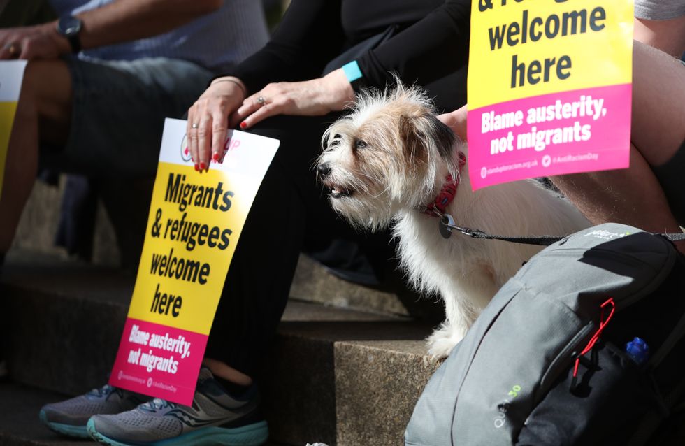 \u200bDemonstrators, with a pet dog, sitting on Buchanan Street steps in Glasgow,