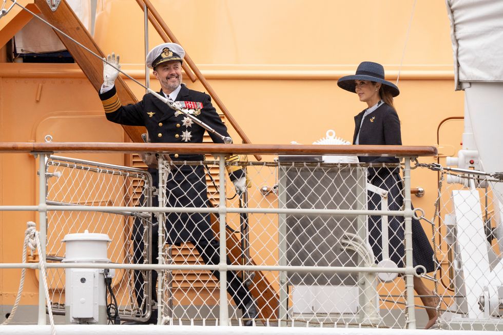 \u200bDenmark's King Frederik and Queen Mary walk onboard the Royal Yacht Dannebrog