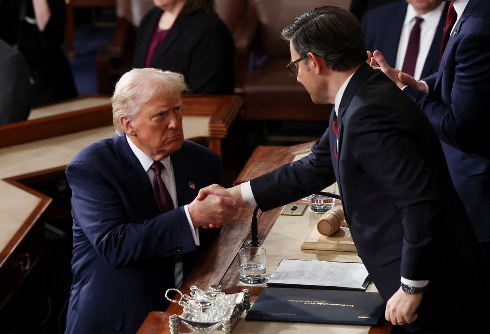 \u200bDonald Trump shook  hands with Speaker of the House Mike Johnson and JD Vance following his address
