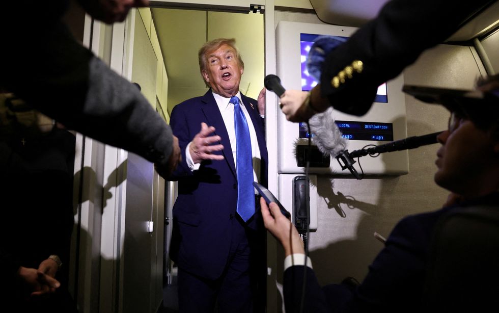 \u200bDonald Trump speaks to reporters aboard Air Force One