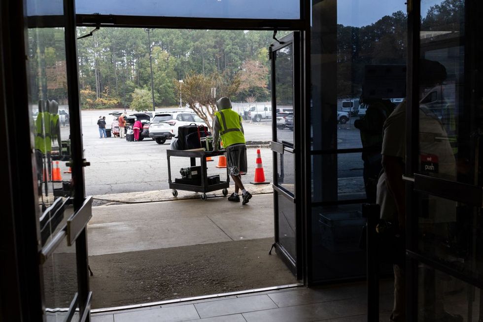 \u200bElection workers distribute election supplies to precinct supervisors at the DeKalb County Voter Registration
