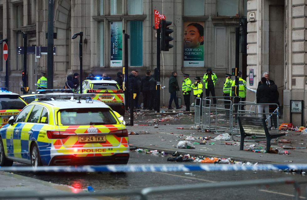 \u200bEmergency services at the scene after multiple people were hit by a car during the victory parade