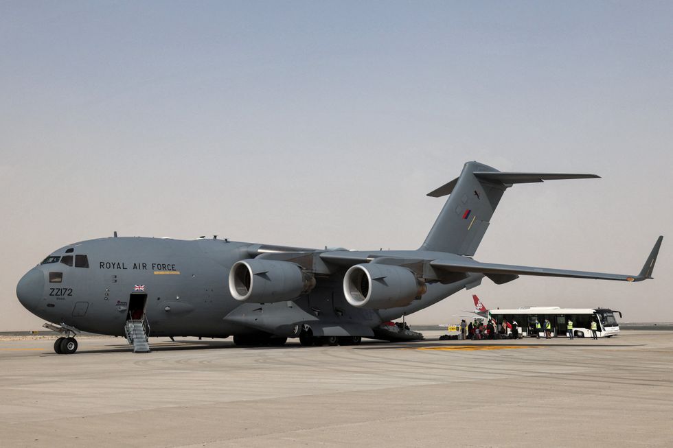 \u200bEvacuees disembark from a Royal Air Force Boeing C-17 transport aircraft after arriving in the UAE from Afghanistan in 2021