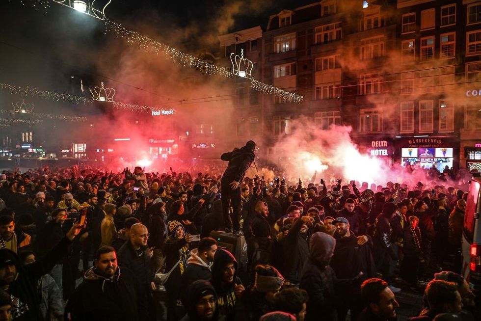 \u200bFans of Maccabi Tel Aviv stage a pro-Israel demonstration at the Dam Square, lighting up flares and chanting slogans