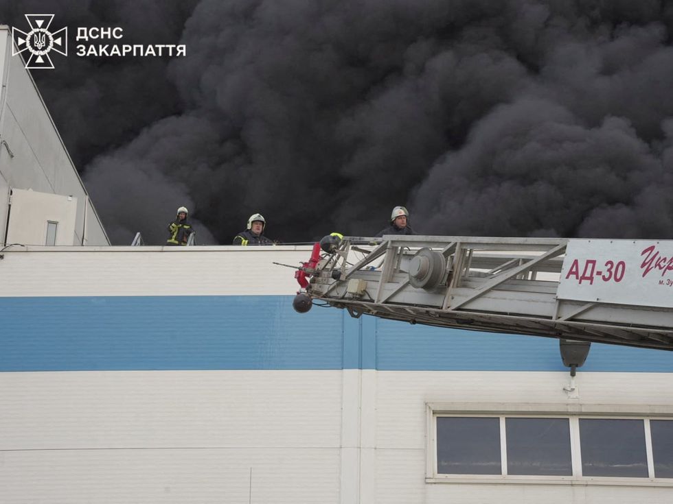 \u200bFirefighters on the roof of the hit building in the Mukachevo region