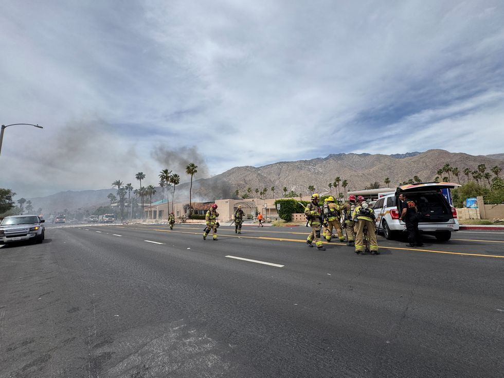 \u200bFirefighters work after a bomb exploded near a reproductive health clinic in Palm Springs
