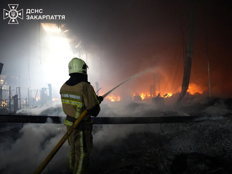 \u200bFirefighters work to put out the fire in the Mukachevo region