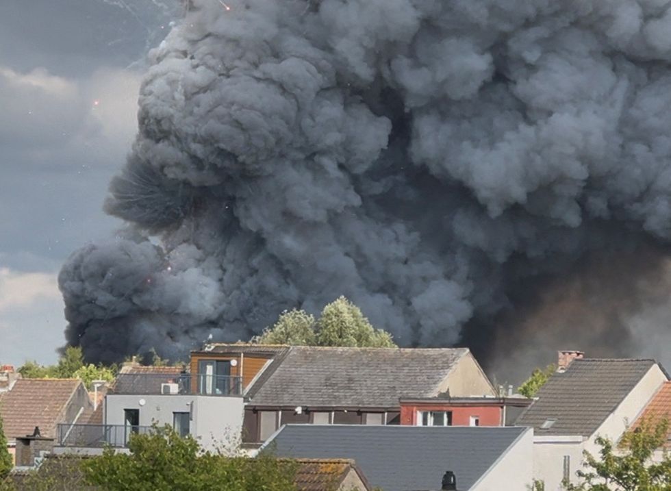 \u200bFireworks burst and smoke rises as a fire engulfs the main stage of Tomorrowland
