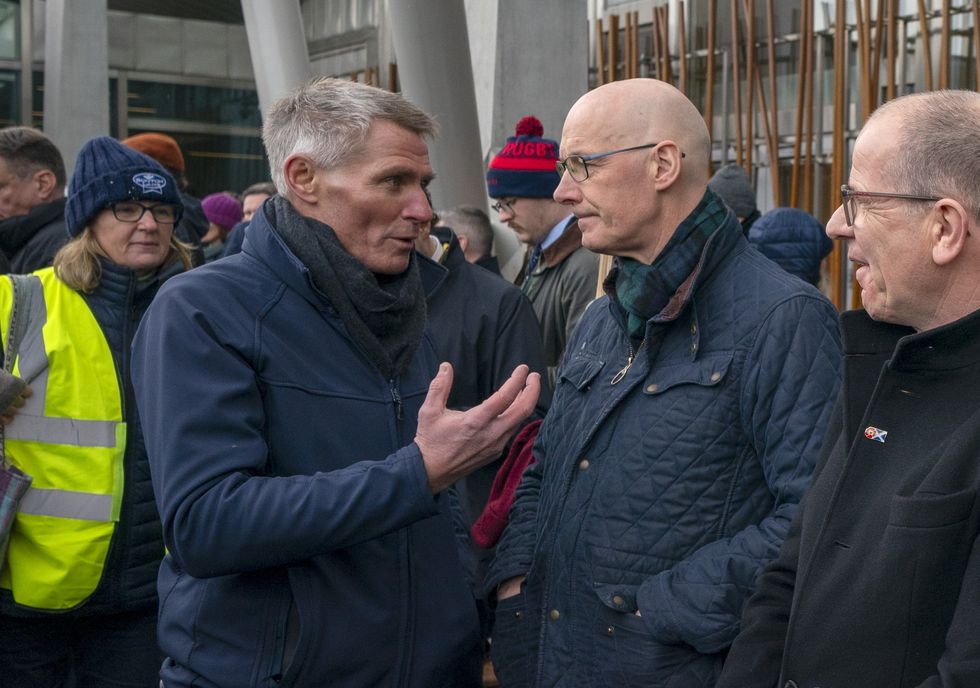 \u200bFirst Minister John Swinney (right) speaks with Jonnie Hall (left) from NFU Scotland