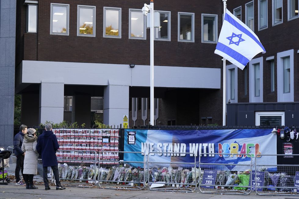 \u200bFloral tributes and images of those kidnapped or missing following October 7