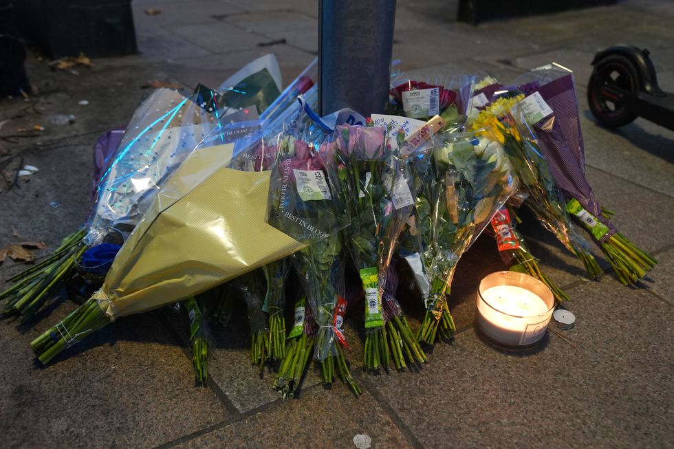 \u200bFloral tributes near Greenhill Street, close to Bedford bus station, following the stabbing of Thomas Taylor