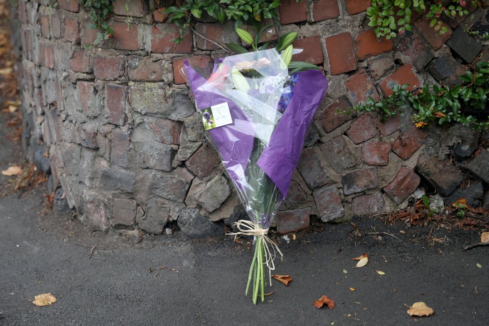 \u200bFlowers lie at the scene