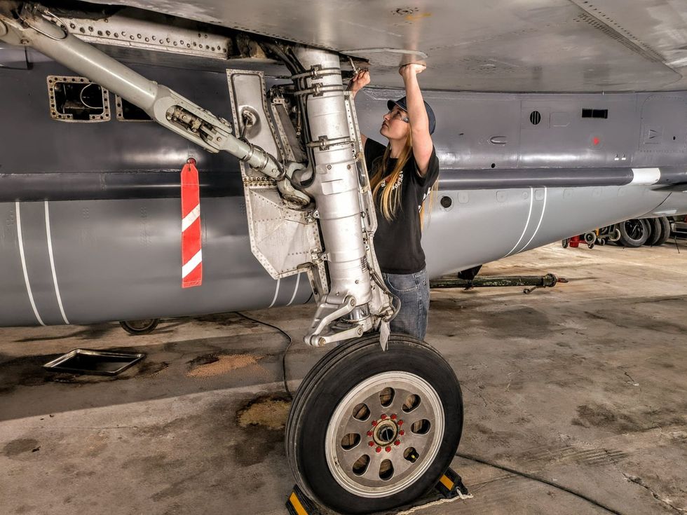 \u200bGrace working on the legendary aircraft