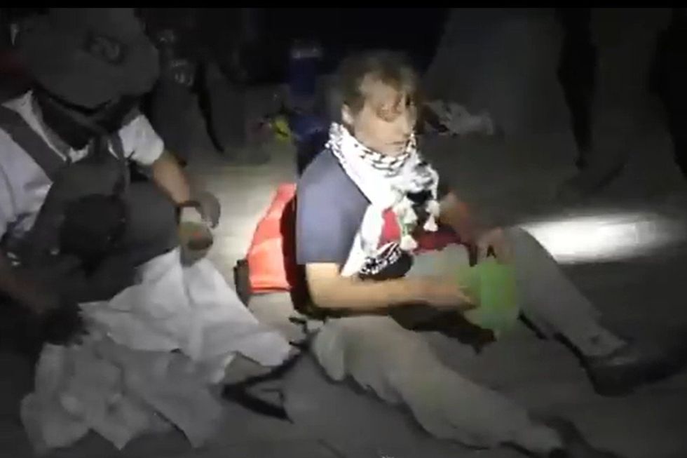 \u200bGreta Thunberg being taken in by Israeli forces