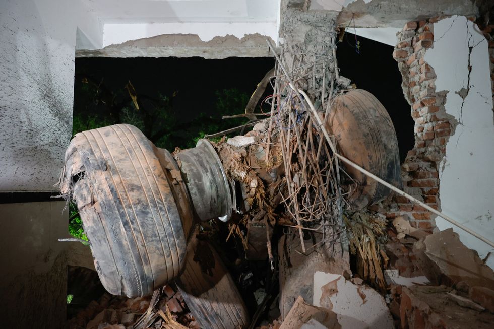 \u200bImages show the wheels of the plane in a building