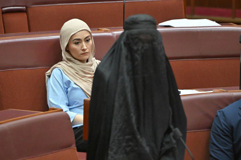 \u200bIndependent senator Fatima Payman sat behind Ms Hanson during her stunt