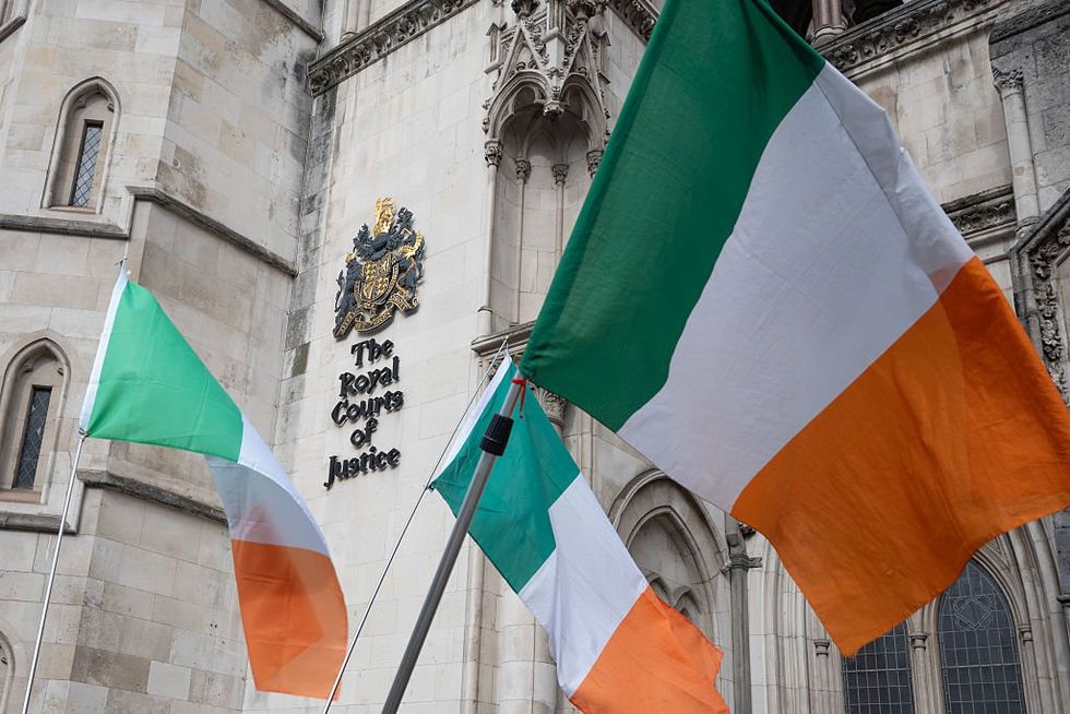 \u200bIrish flags seen outside the Royal Courts of Justice where Gerry Adams is currently standing accused of being directly responsible for IRA bomb attacks