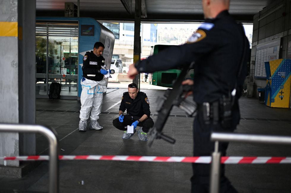 \u200bIsraeli police work at the site where a suspected stabbing attack took place in Haifa, Israel