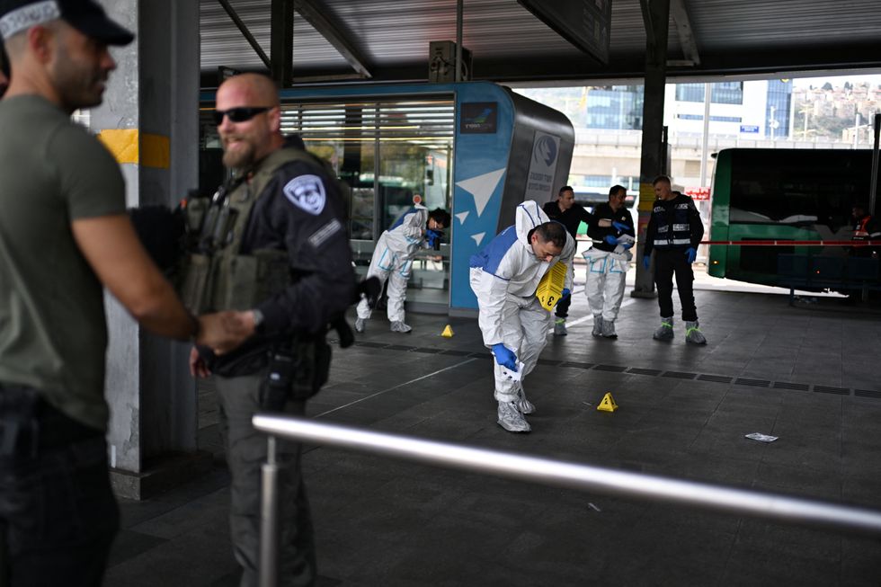 \u200bIsraeli police work at the site where a suspected stabbing attack took place in Haifa