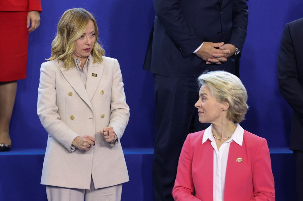 \u200bItaly's Prime Minister Giorgia Meloni gestures next to European Commission President Ursula von der Leyen