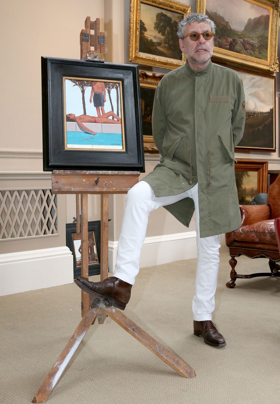 \u200bJack Vettriano at Bonhams in Edinburgh as he stands beside his Winsor and Newton easel and his painting An Unexpected Guest