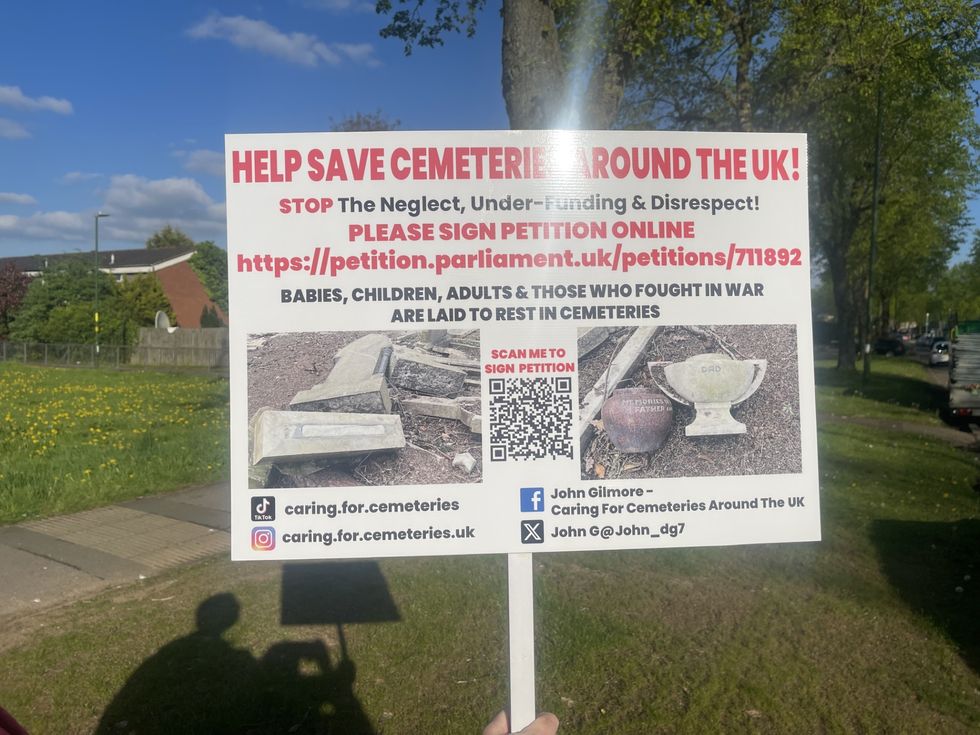 \u200bJohn Gilmore's sign campaigning to save cemeteries around the UK