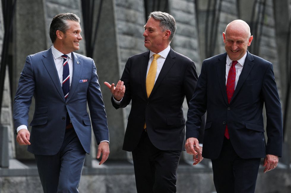 \u200bJohn Healey alongside his US and Australian counterparts