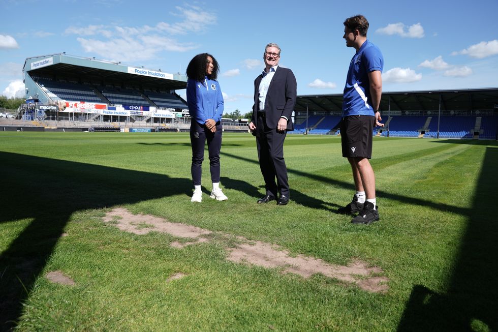 \u200bLabour Party leader Sir Keir Starmer (centre) with players during a visit to Bristol Rovers FC