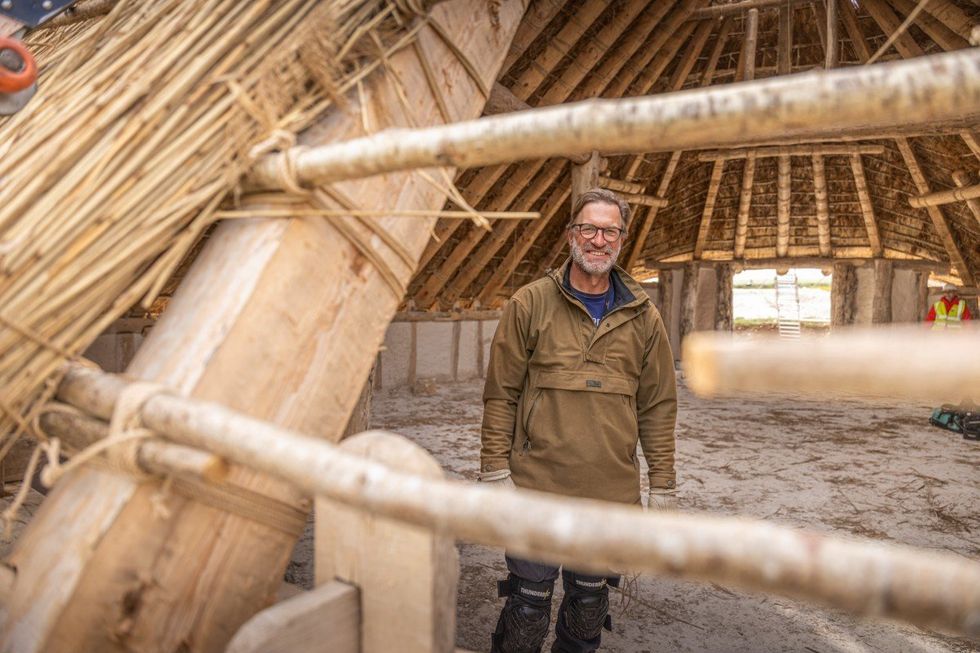 \u200bLuke Winter in the reconstructed hall at Stonehenge