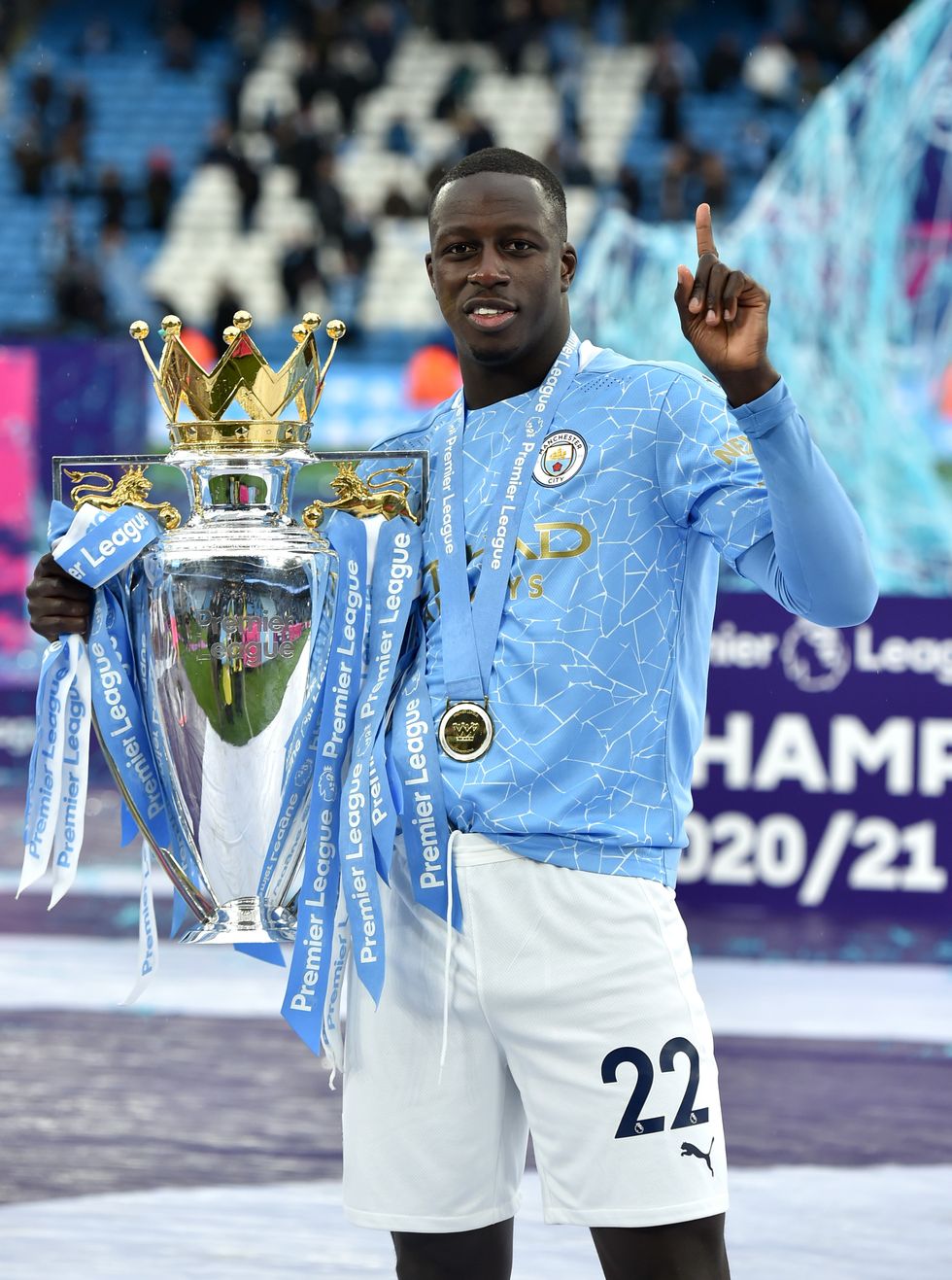 \u200bManchester City's Benjamin Mendy celebrates with the Premier League trophy at Etihad Stadium, Manchester on May 23, 2021.