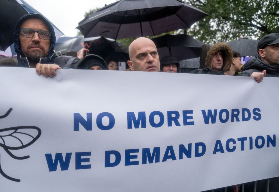 \u200bManchester locals have held a banner saying: 'No more words - we demand action'