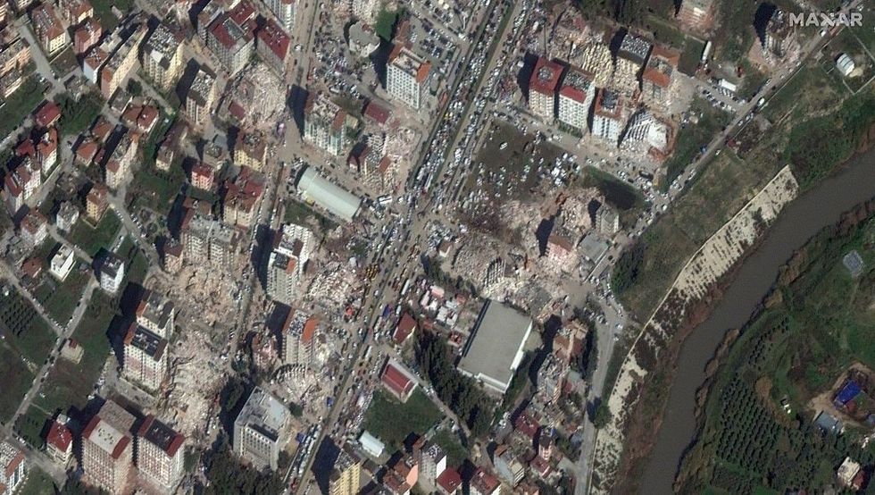 \u200bMaxar satellite imagery shows extensive building damage with many collapsed structures and rubble in an urban area.