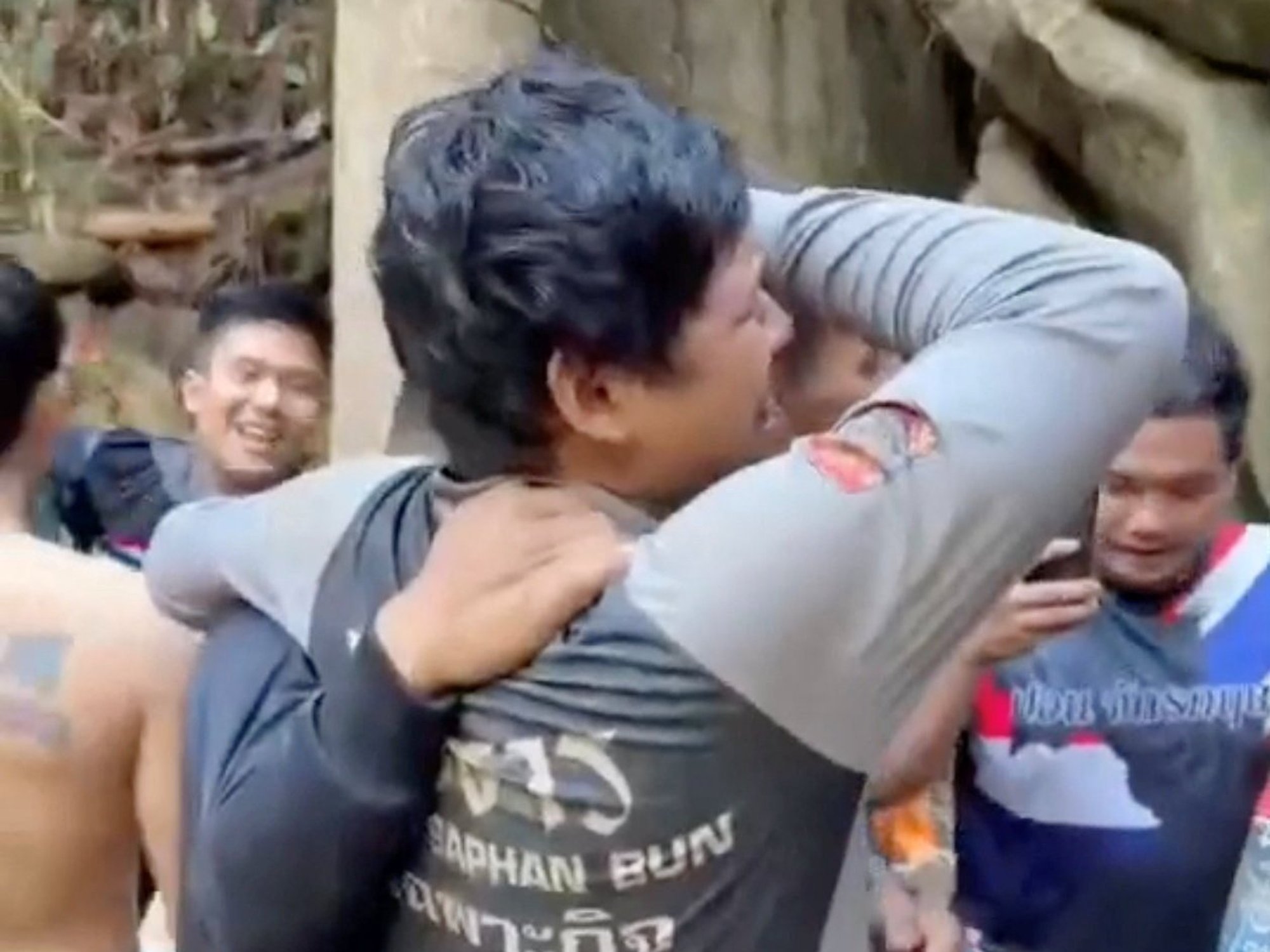 \u200bMembers of a rescue team celebrated on the surface