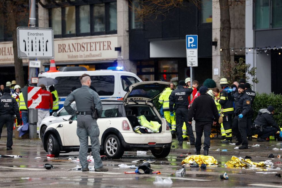 \u200bMembers of the emergengy services work at the scene where a car drove into a crowd in the southern German city of Munich