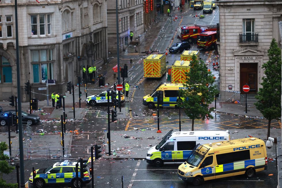 \u200bmergency services at the scene after multiple people were hit by a car during the Victory parade