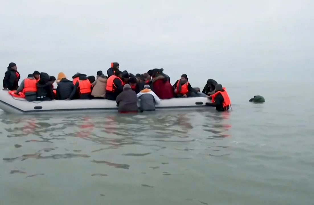 \u200bMigrants aboard a small boat
