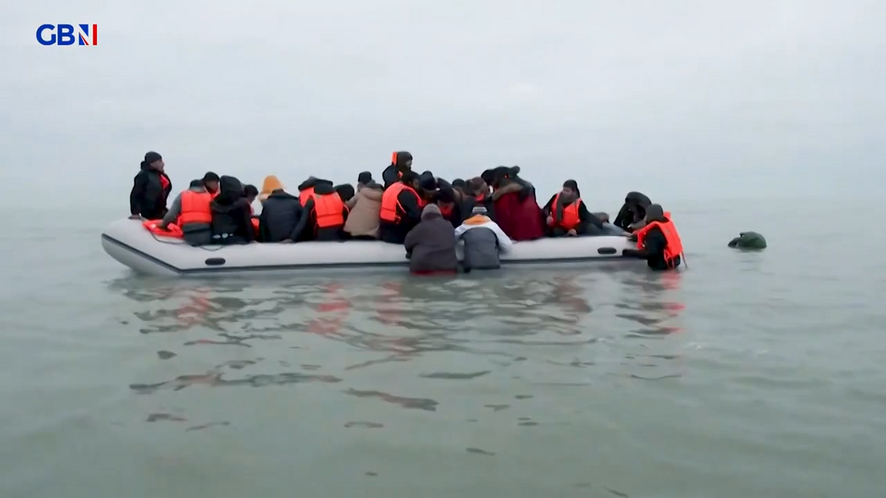 \u200bMigrants aboard a small boat