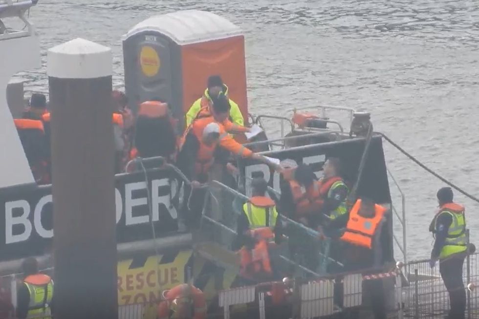 \u200bMigrants arrive at Dover after boats launched in stormy conditions