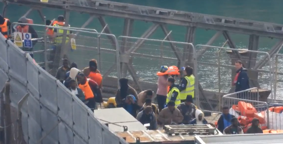 \u200bMigrants pictured arriving in the UK this morning