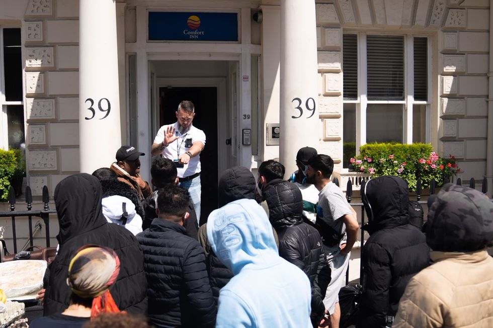 \u200bMigrants protest outside hotel in Pimlico, central London, over the living conditions inside