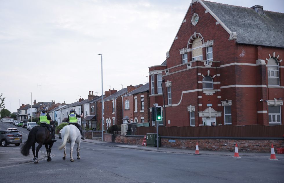 \u200bMounted police officers patrol outside Southport Islamic Centre Mosque in Southport
